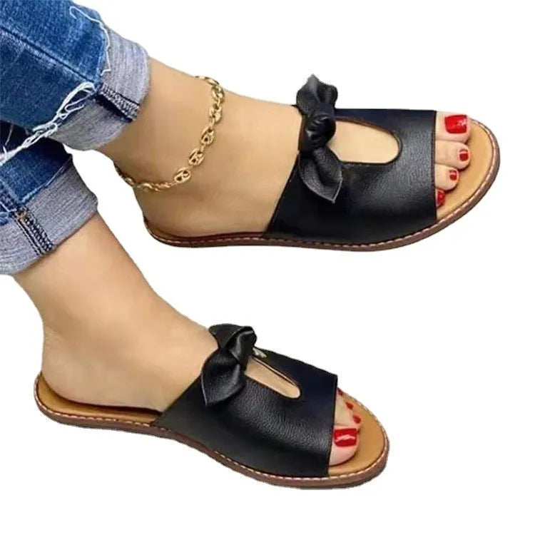 Ladies sandals with bow detailing and fish mouth slipper style in black, gold and pink colours