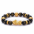 Unisex natural black agate stone bracelet with imitation gold accent, round bead design
