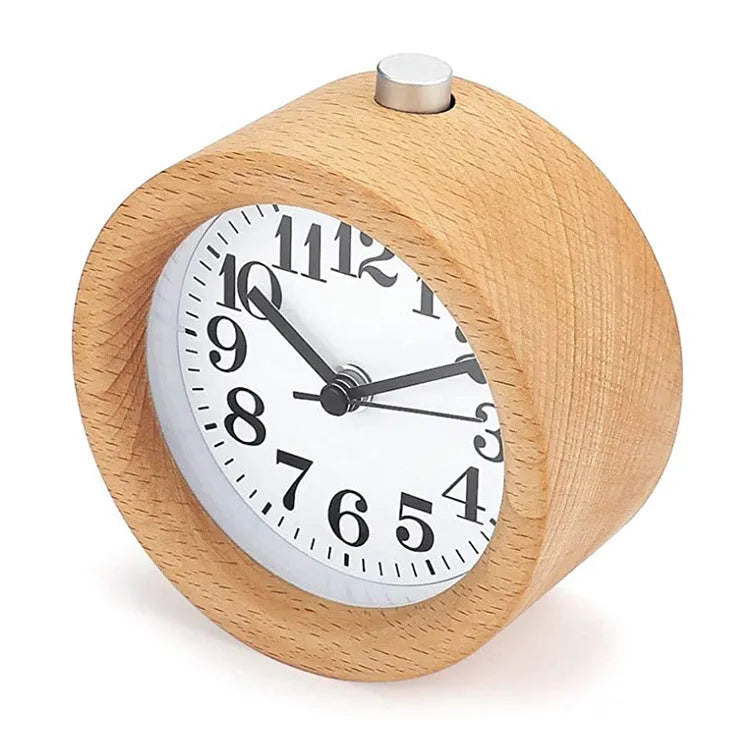 Solid beech wood silent snooze alarm clock with white dial and black numerals on a wooden surface.