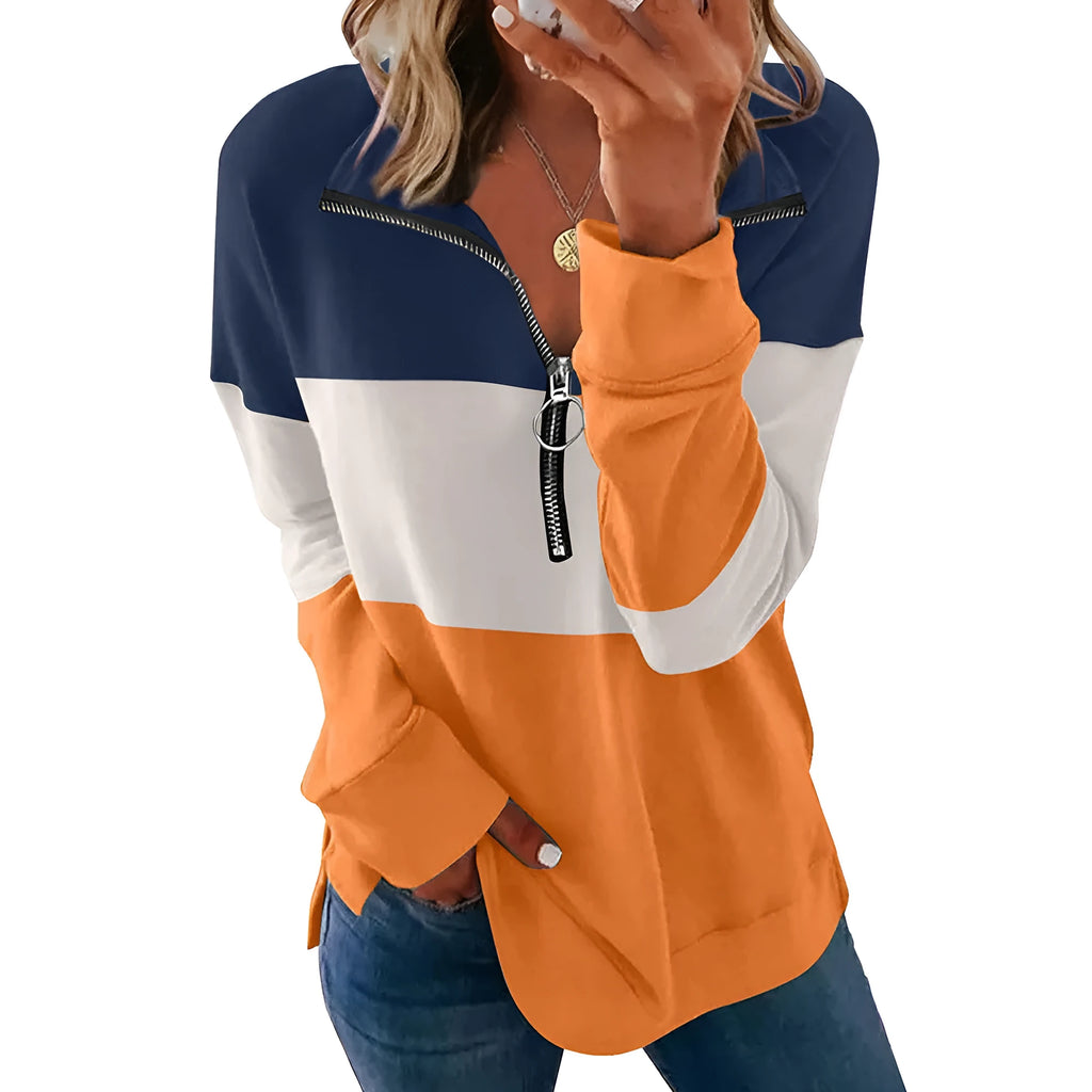 Women's loose long-sleeved leopard print pullover sweater in polyester on a hanger.