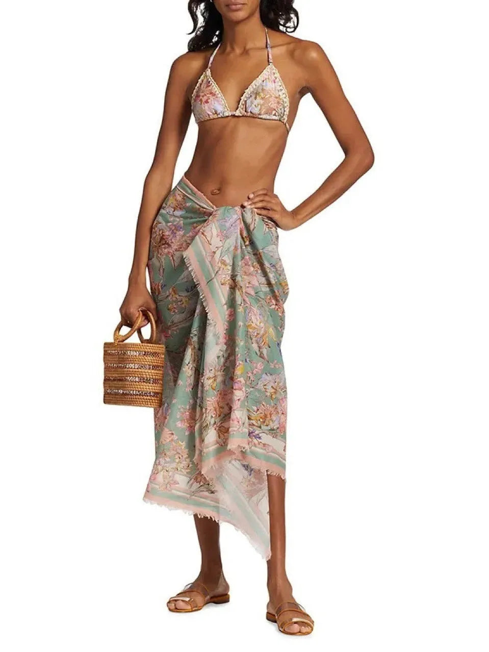 Women's floral pattern bikini set with top, briefs, and skirt in creamy-white colour