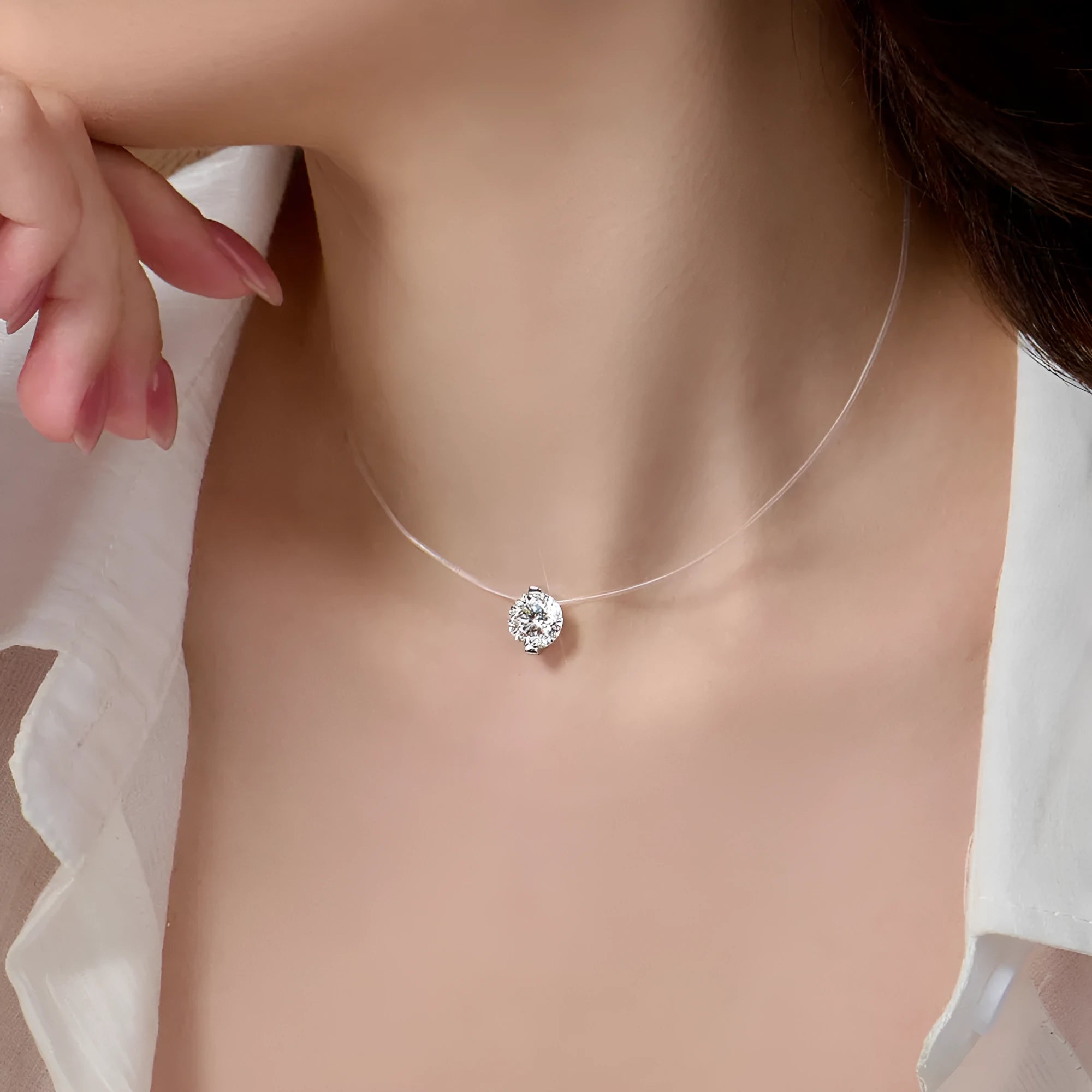 Women's silver necklace with floating moissanite plum blossom pendant on invisible fishing line chain