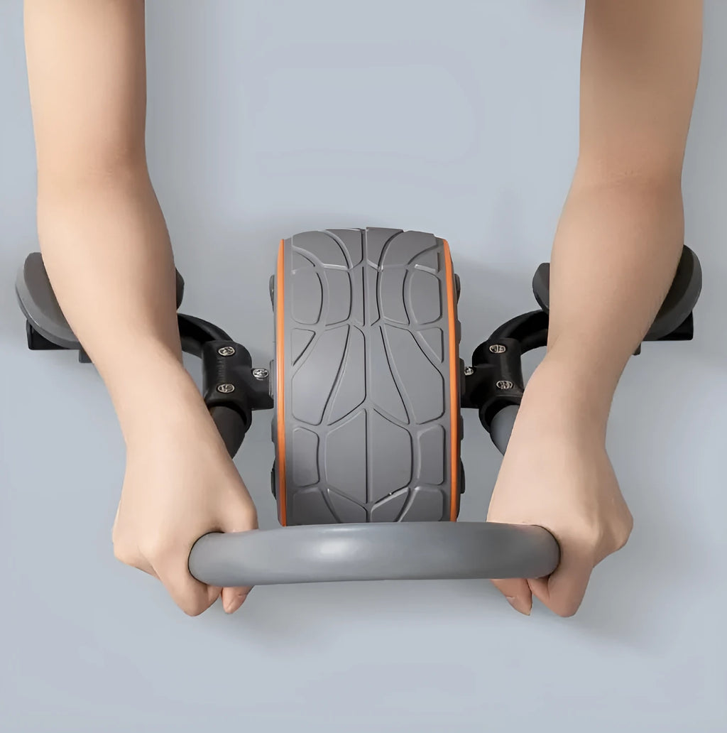 Shadow grey abdominal exercise wheel with stainless steel and TPR construction on a kneeling mat