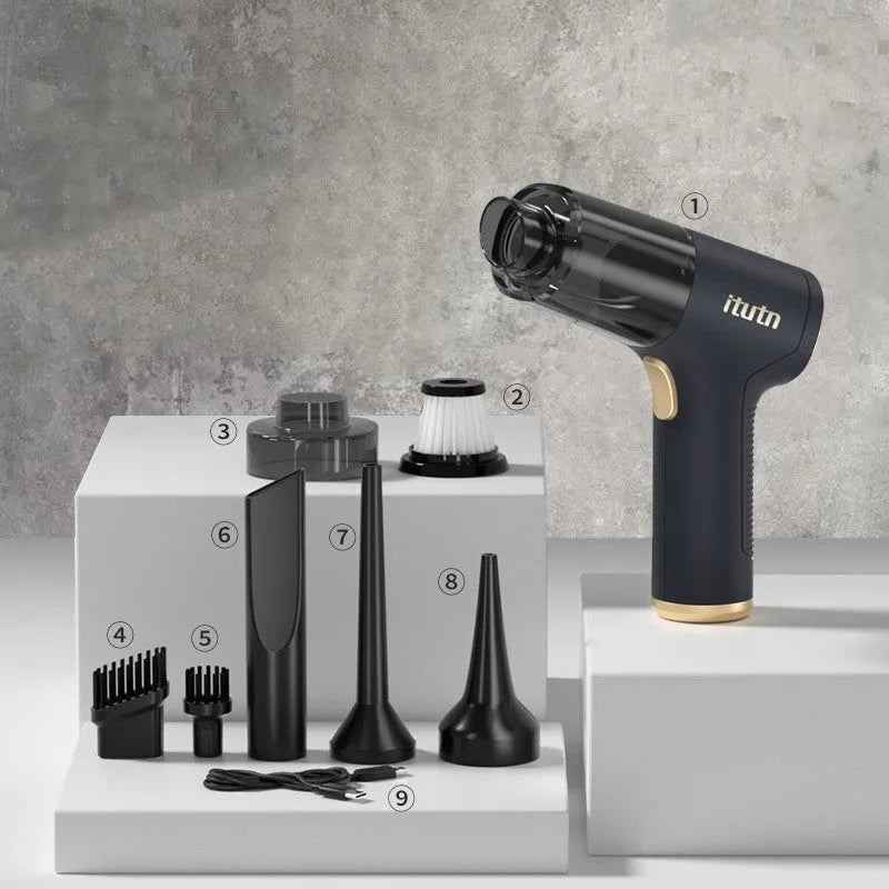 Black cordless handheld car vacuum cleaner with attachments including brush head and inflation nozzles.