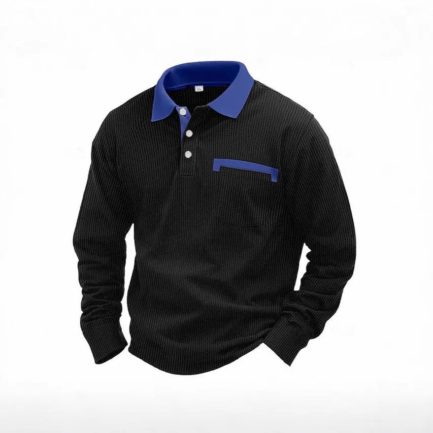 Man wearing a loose-fit long-sleeved polo shirt with a waffle knit texture in a dark blue colour.