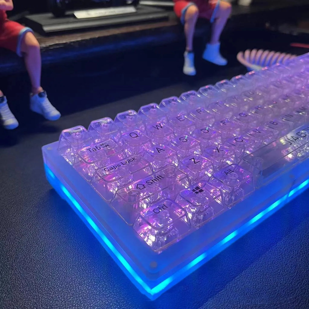 Transparent plastic keyboard key caps arranged as complete 132-key set for mechanical keyboard replacement