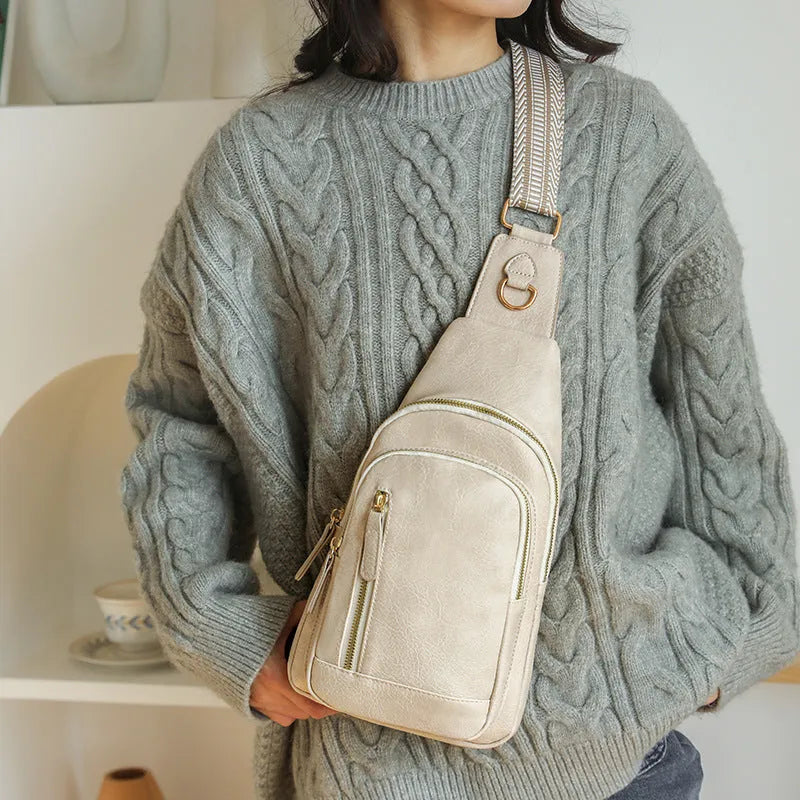 Women's soft brown PU leather crossbody chest bag with open pocket and adjustable strap.
