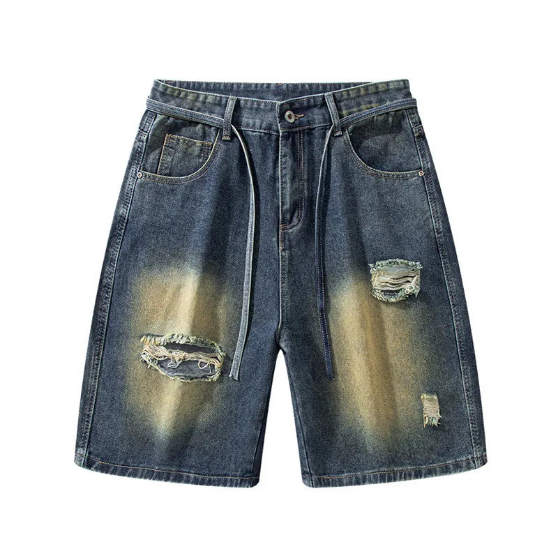 Retro blue loose fit ripped jeans with distressed detailing on denim fabric