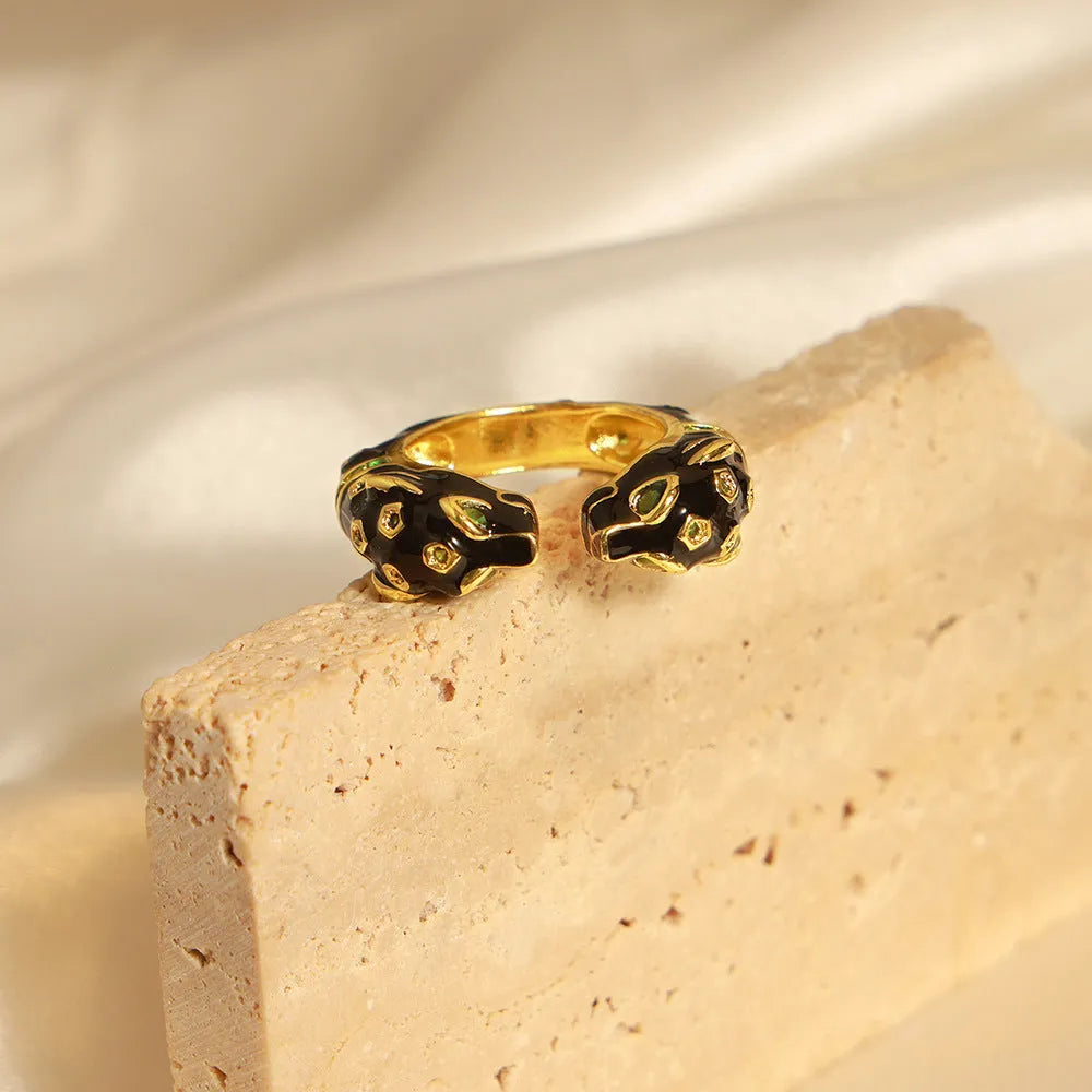 Women's copper geometric open ring with black electroplated cheetah pattern, shown in size 7.
