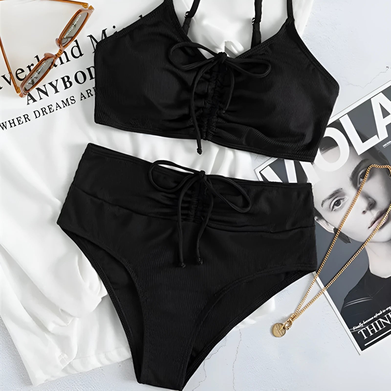 Black high-waisted women's bikini swimsuit with sling split design