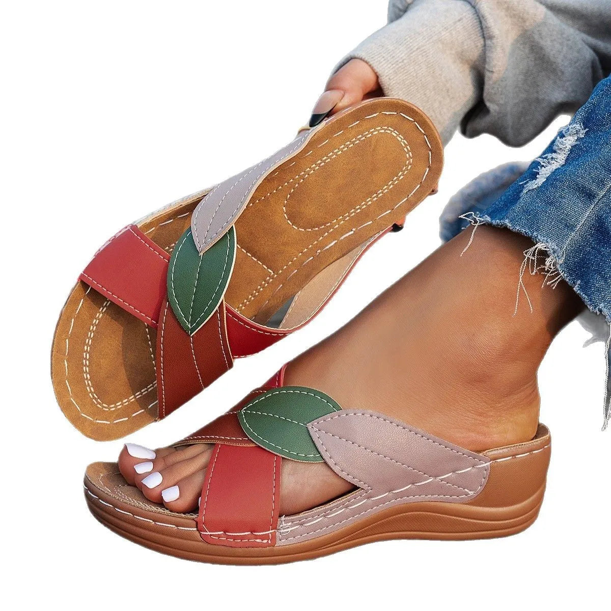 Women's black cross-strap peep-toe slippers with a thick polyurethane sole on a white background.