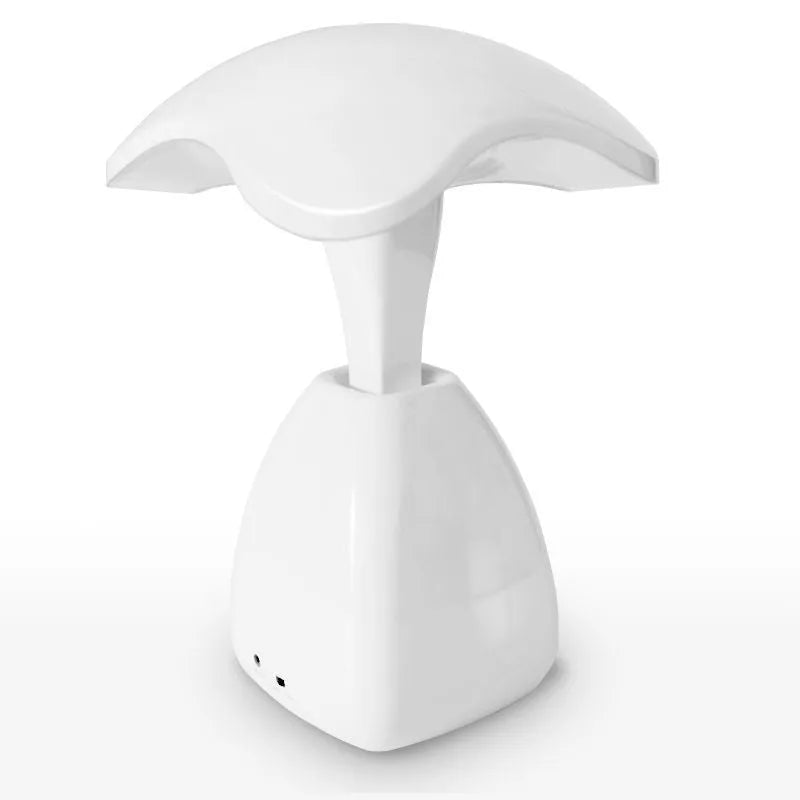 White modern LED desk lamp with touch controls and built-in battery for bedside use