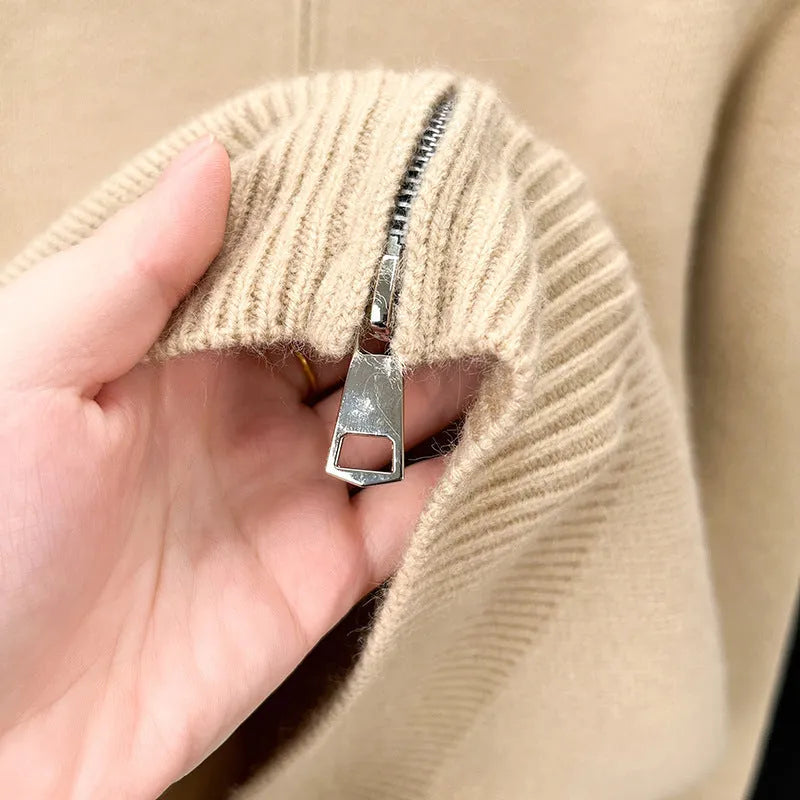 Men's black stand collar zipper cardigan in a loose, thickened knit on a hanger.