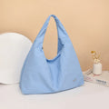 Heart-shaped nylon underarm bag for women in black, blue, khaki, and yellow colour options