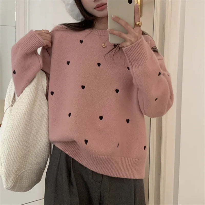 Women's acrylic pullover sweater with embroidery detail in milky white colour showing loose fit design