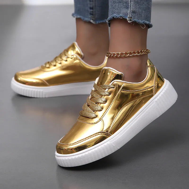 Rose gold sequinned platform sneakers with round toe and thick MD sole on a white background