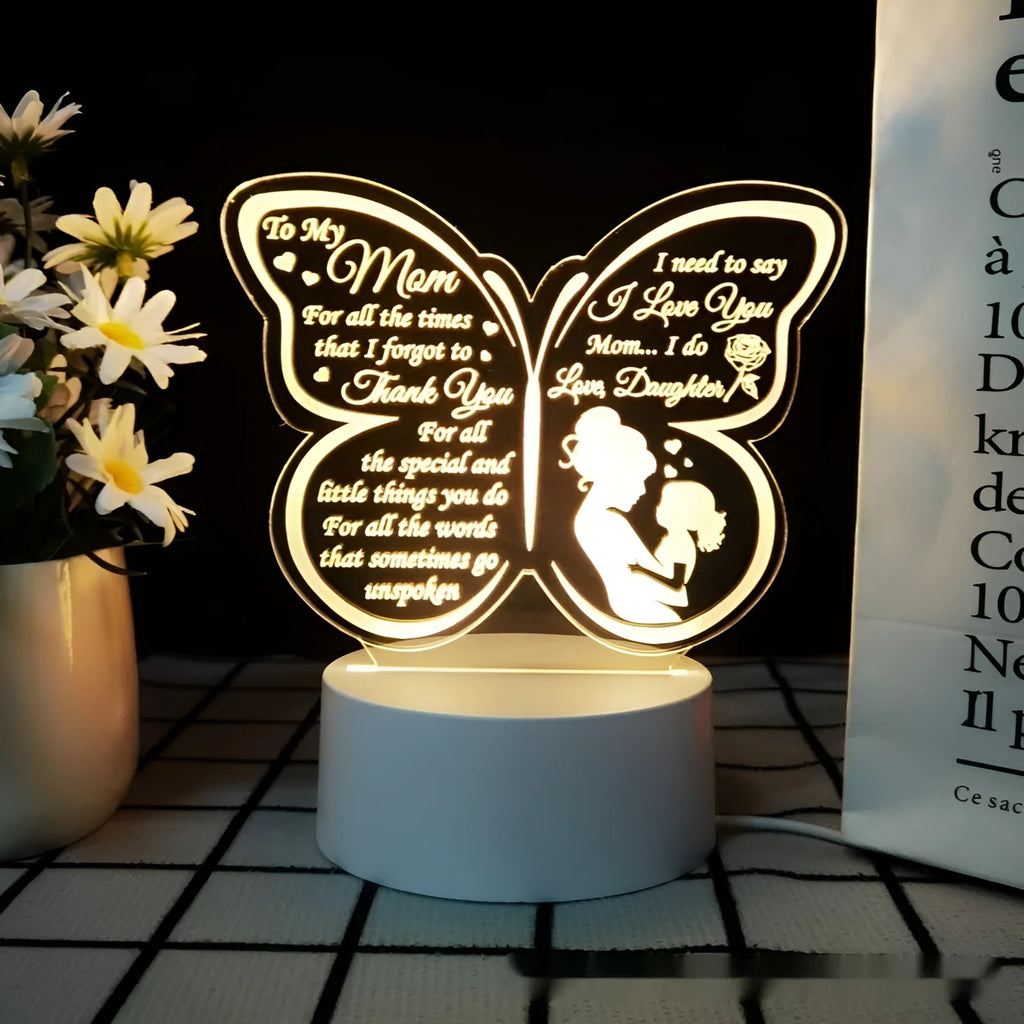 White heart-shaped acrylic table lamp with a touch switch base on a wooden surface.