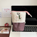 Brown Korean-style cartoon pencil case with Oxford fabric and collapsible design measuring 17x14cm