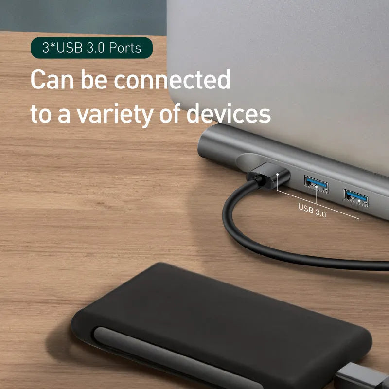 Grey aluminium alloy USB C hub docking station with cooling bracket showing ten ports including HDMI and VGA