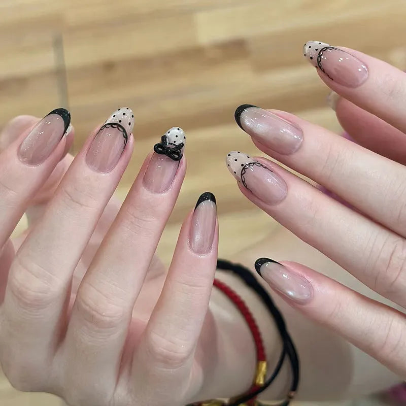 Pack of sweet girl style fake nails showing random colour designs in a set of ten.