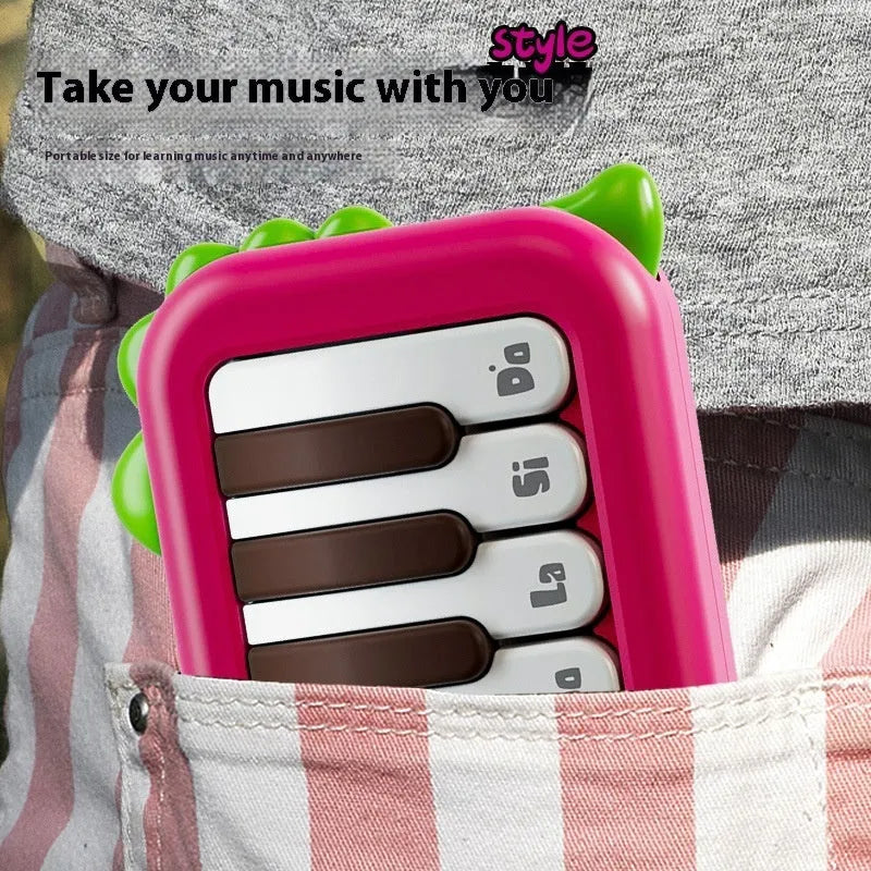 Baby pocket electronic keyboard with little piano pattern in green plastic design
