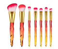 Set of 10 clear crystal foundation brushes with coloured handles.