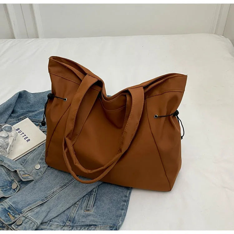 Soft Oxford cloth folding tote bag shown in multiple colours: black, brown, grey, and purple.