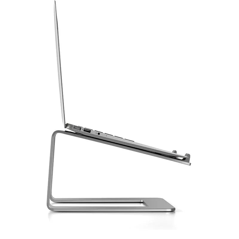 Black aluminium alloy laptop stand on a desk, showing its wide base plate and elevated height.