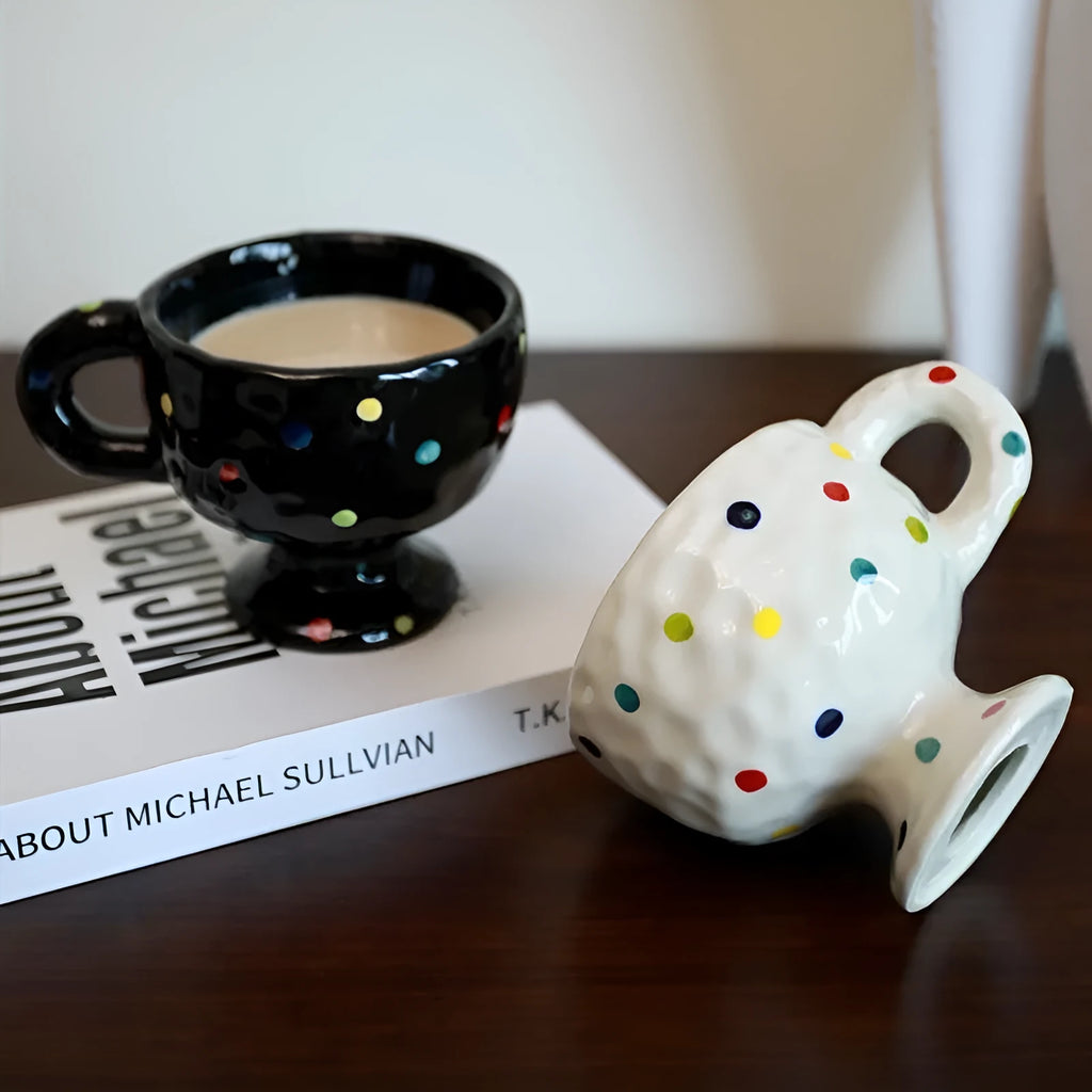 Hand-pinched irregular shaped ceramic mug in a solid colour, showing its unique form.
