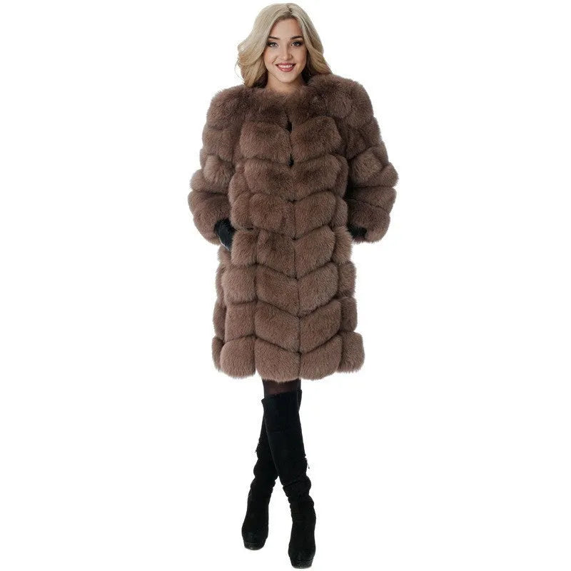 Women's long black artificial fur coat with regular sleeves, shown on a model.