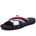 Men's white cowhide and PU non-slip flip-flops on a sandy beach background