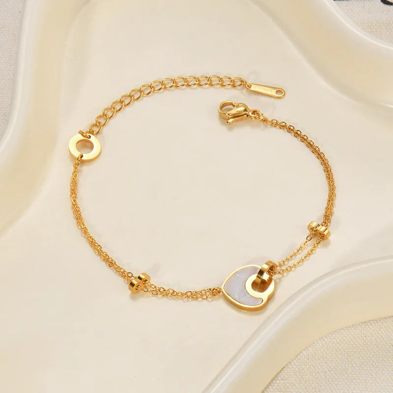 Stainless steel resin bracelet with a double-layer loving heart charm for women.