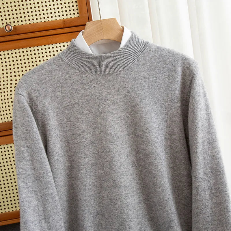 Man wearing a loose-fit half-collar wool sweater in a winter setting.