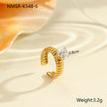 Gold-inlaid zircon geometric stainless steel ring with open mouth design on a white background.
