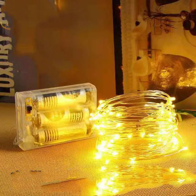Copper wire string light with 120 LED bulbs in twelve metre length for outdoor decoration