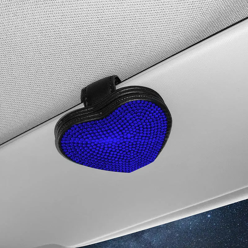 Black diamond-encrusted PU leather car sun visor clip holding sunglasses and a ticket.