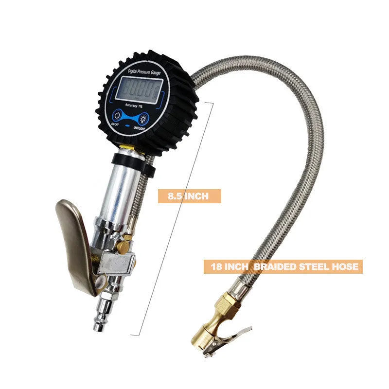 Digital tire pressure gauge with black silver metal body, backlit display, and braided hose on a tyre valve