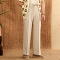 Straight-leg linen trousers with elasticated high waist in greige, navy blue, and white colours