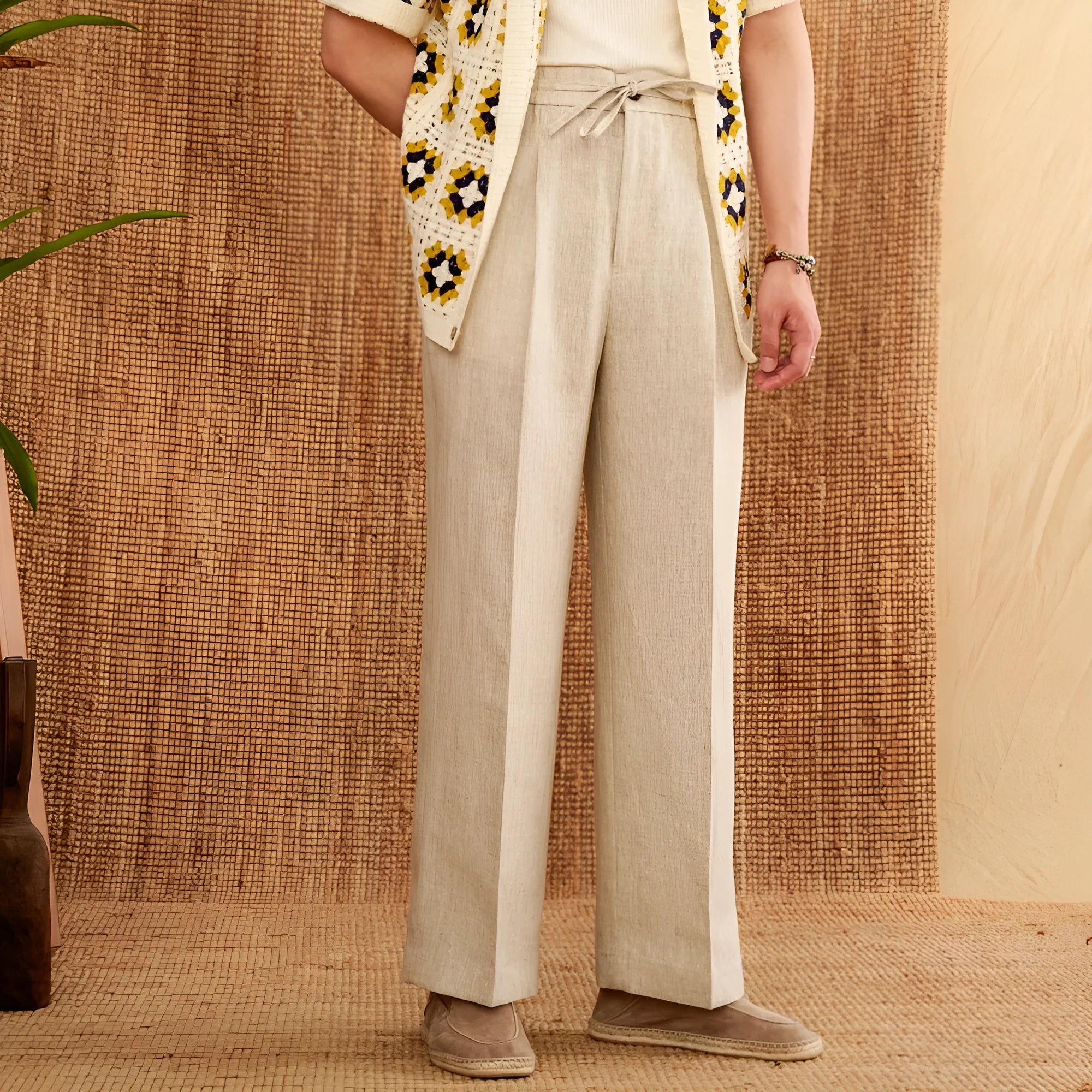 Straight-leg linen trousers with elasticated high waist in greige, navy blue, and white colours