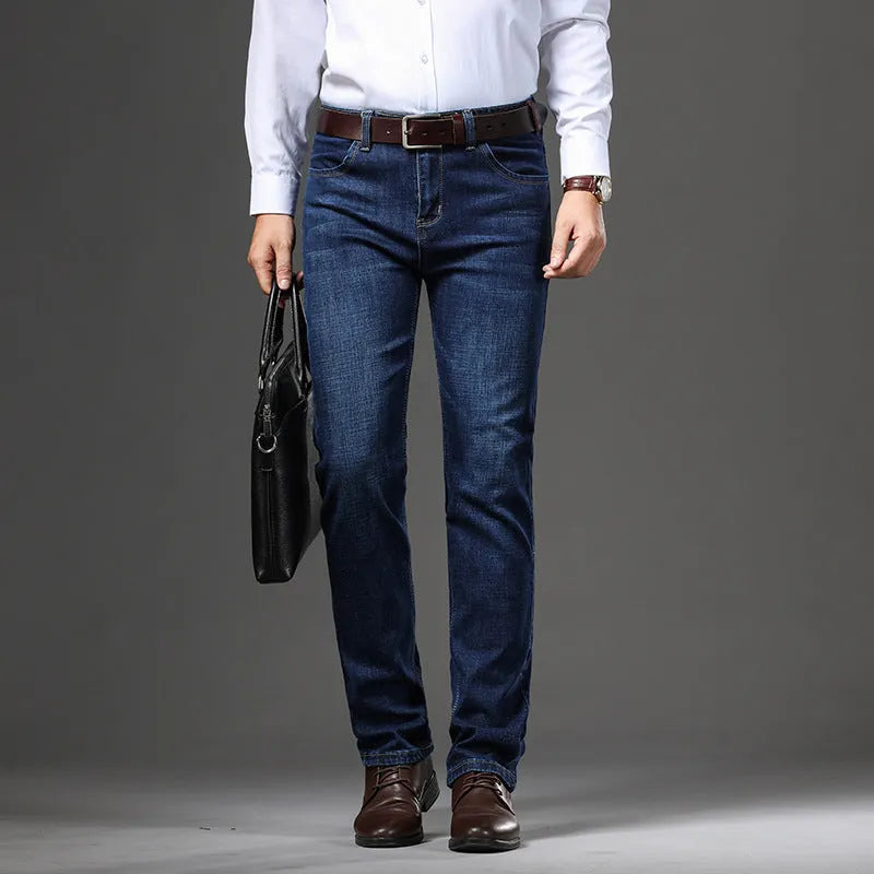 Men's black and blue stretch denim jeans showing straight-leg business casual style with mid waist and zip fly