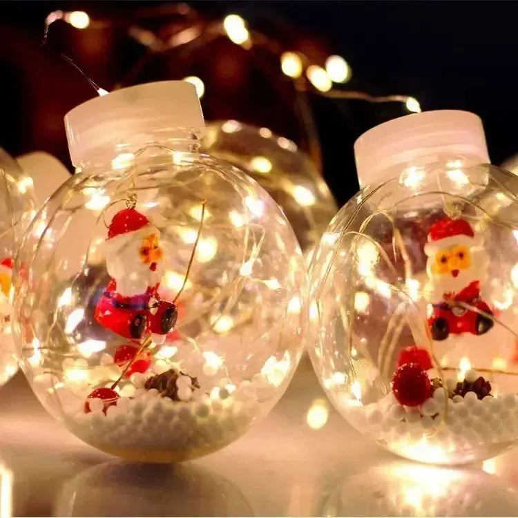 Set of 10 LED Christmas curtain lights with fairy and snowman wishing ball designs on a string.