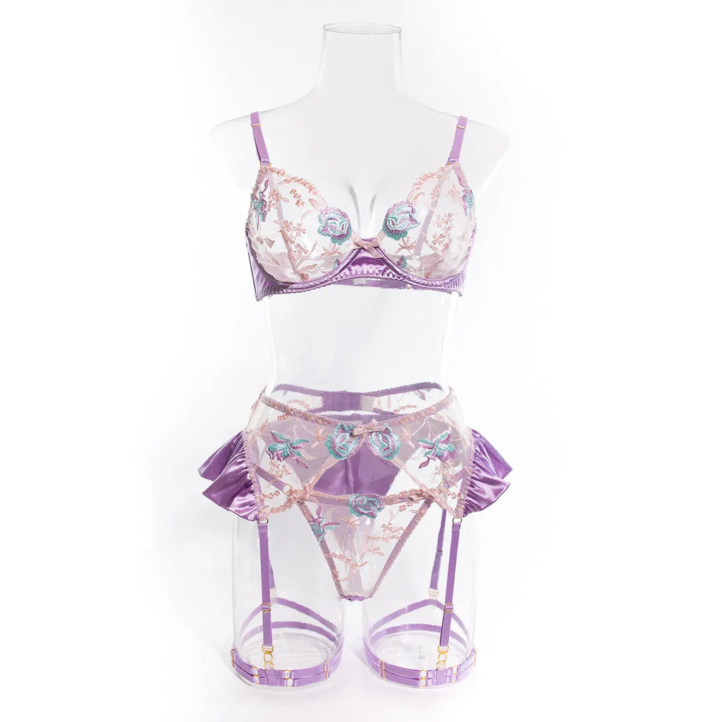 Light purple satin lingerie four-piece set with embroidery detail, shown alongside champagne colour option.