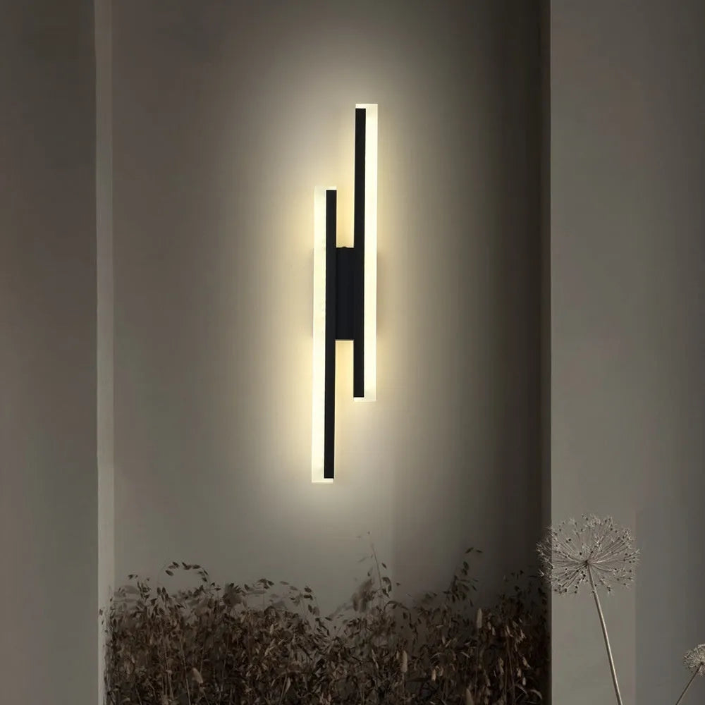 Gold finished double line wall lamp with tri-colour lighting for hotel stairs and modern interiors