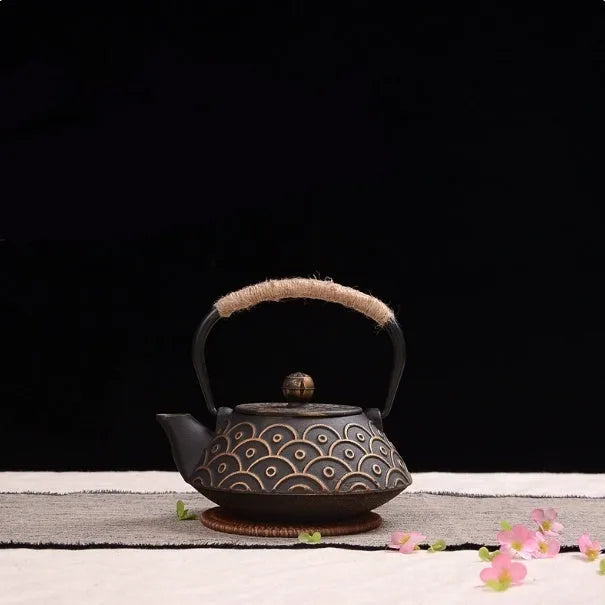 Japanese style cast iron teapot with 0.9 litre capacity shown in a bronze finish.