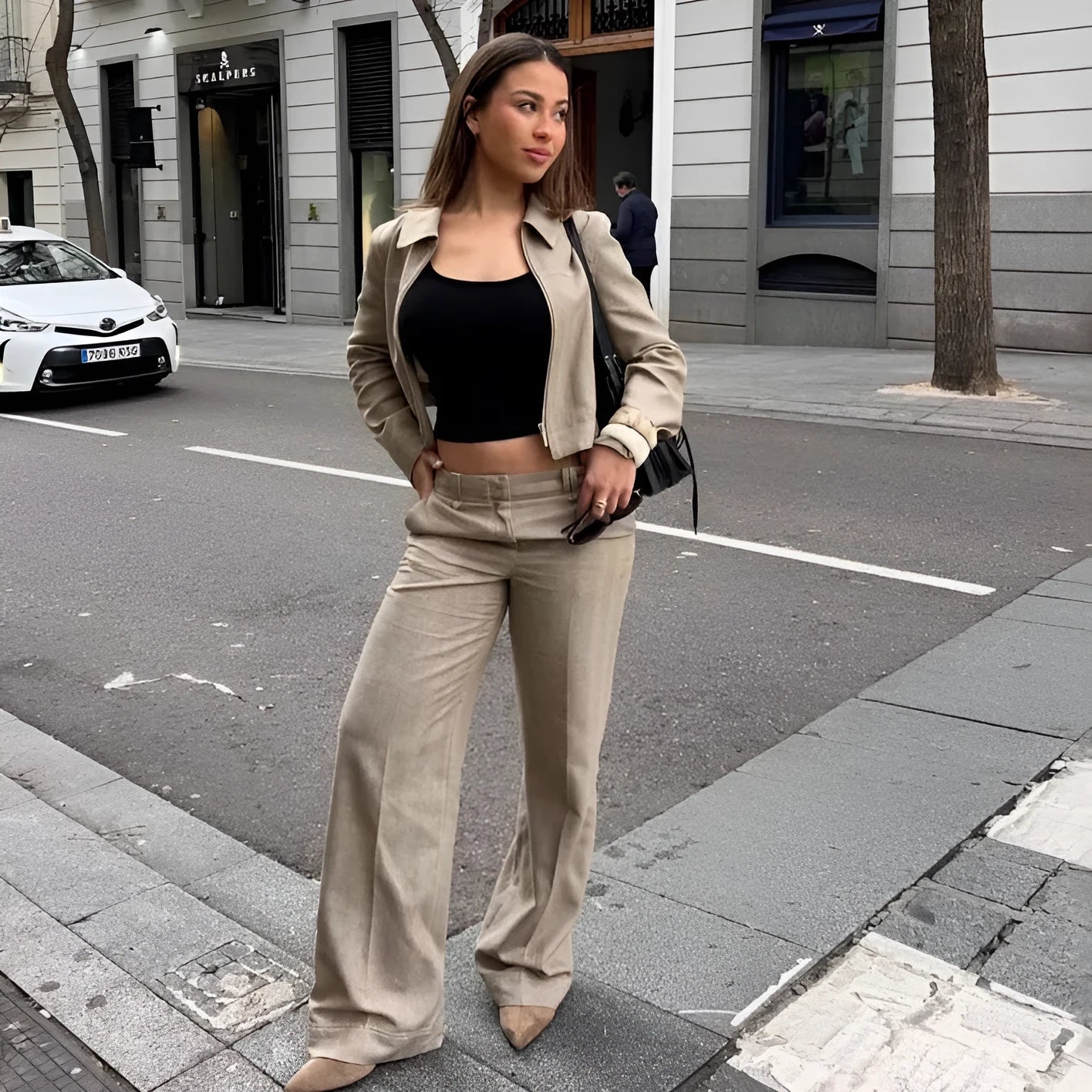 Women's herringbone pattern two-piece suit with embroidered jacket and straight-leg trousers