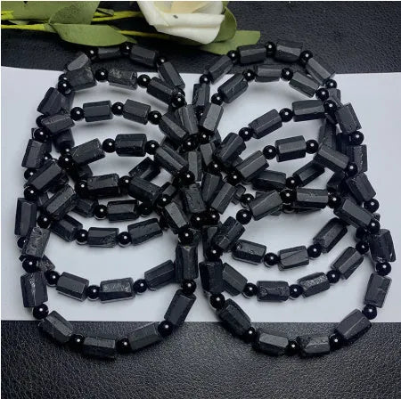 Natural black tourmaline bracelet with Seiko-treated beads approximately 9mm diameter