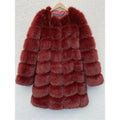 Women's long black artificial fur coat with regular sleeves, shown on a model.