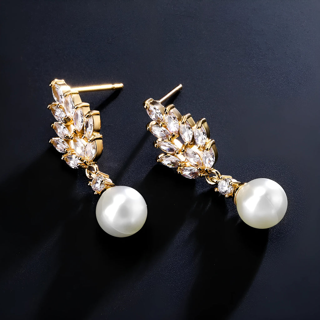 Geometric floral earrings with micro inlaid zircon and pearl details on copper with gold plating