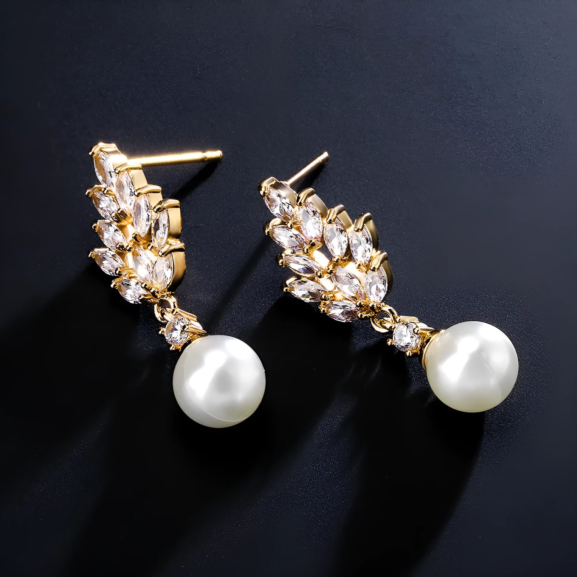 Geometric floral earrings with micro inlaid zircon and pearl details on copper with gold plating