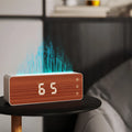 White flame humidifier with clock display on a desk, showing mist output